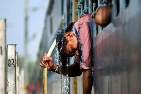 a women pouring water over head in heatwave