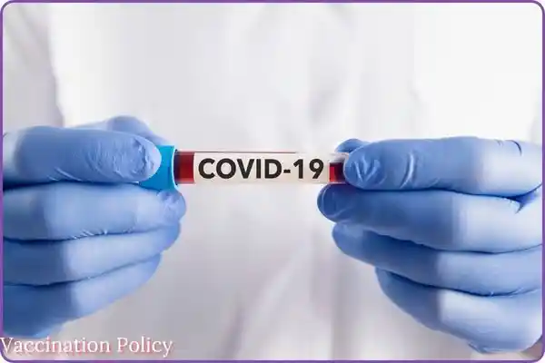 Vaccination policy is written with pic of COVID-19 vaccine